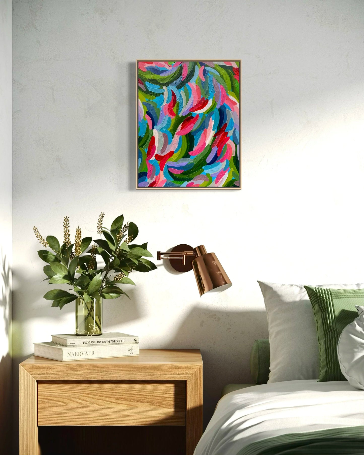 Modern bedroom with a colorful abstract painting on the wall, a bedside table with a lamp and plant, and a bed with pillows.