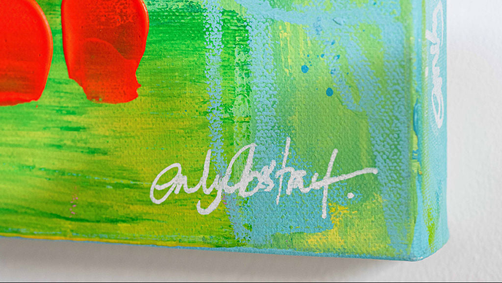 Abstract canvas wall art featuring textured green and light blue brushstrokes with bold red circular and oval shapes on the left, plus a white artist signature near the bottom.