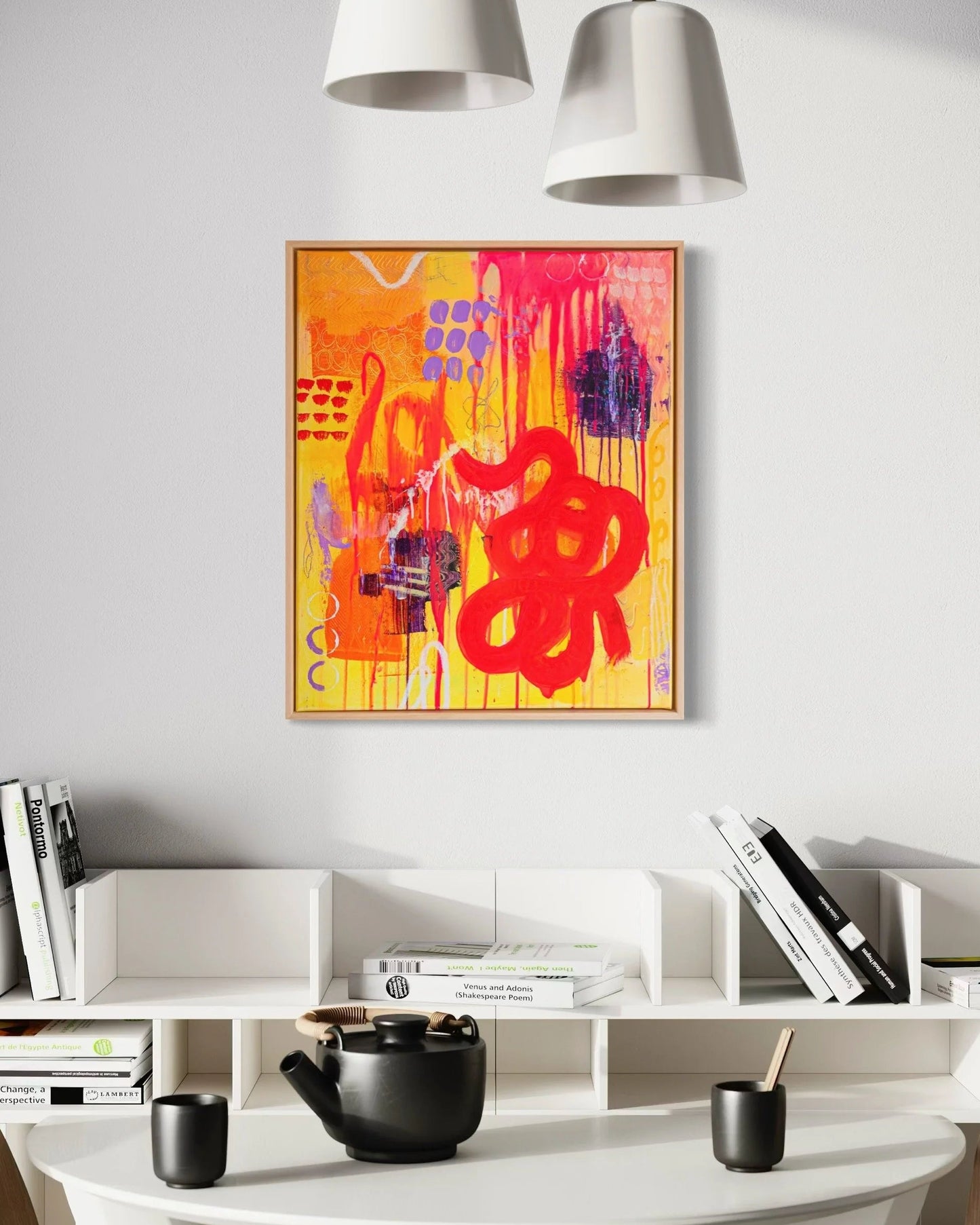 Modern interior with a round white table, chairs, and a colorful abstract painting on the wall.